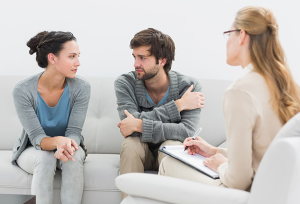 Young couple in meeting with a financial adviser at home